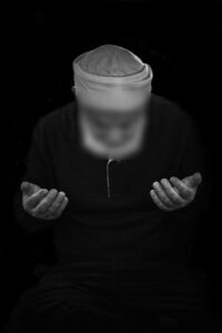 A Muslim reciting morning adhkār after the Fajr prayer